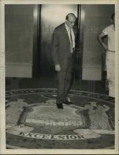 1962 Press Photo Harry Kalfaian inspects rug at State Capitol, Albany, New York picture