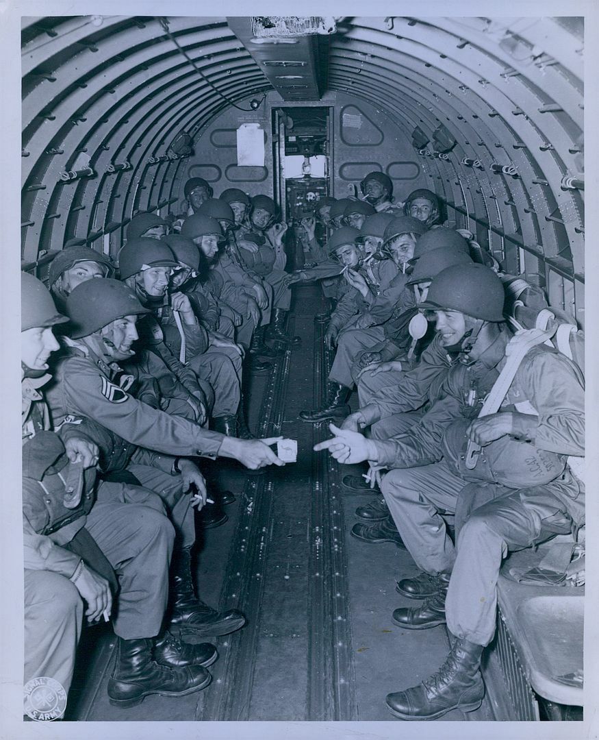 1943 Fort Benning Paratroopers Having a Smoke on Plane Transport Press Photo