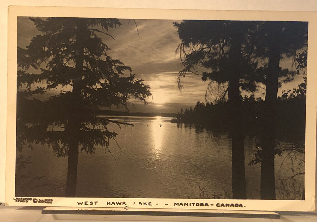 POSTCARD WEST HAWK LAKE -MANITOBA-CANADA SUNSET THRU THE PINES RPPC 1949