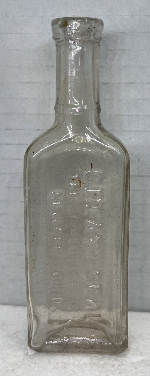 Vintage Embossed Great Seal Styron Beggs Co. Newark Ohio Bottle