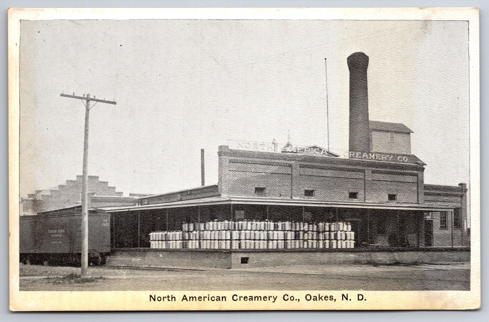 Oakes North Dakota~North America Creamery Co~Train Cars~1920s Postcard
