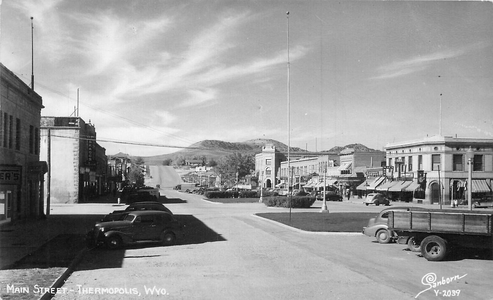 Postcard RPPC 1940s Wyoming Thermopolis Main Street Sanborn auto Truck 23-13091