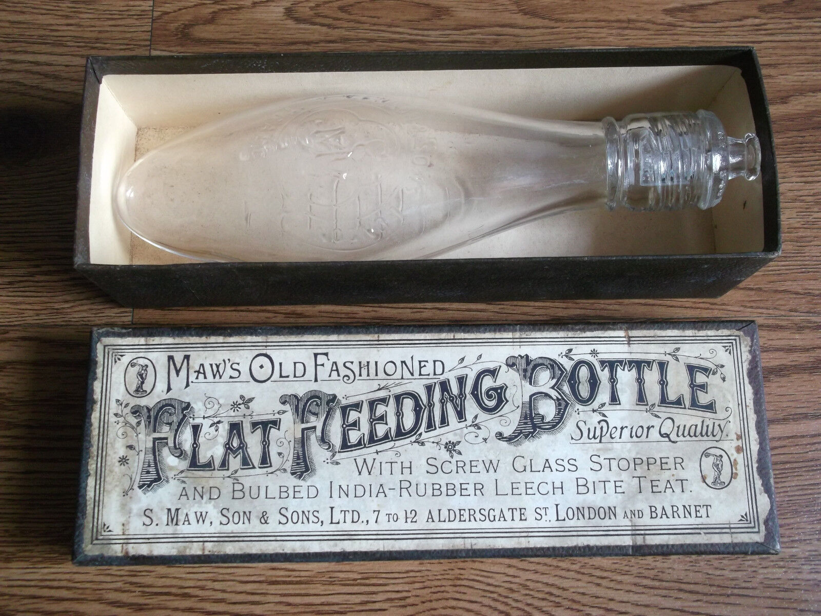 Rare vintage MAW'S old fashioned flat feeding bottle of 40's London and Barnet.