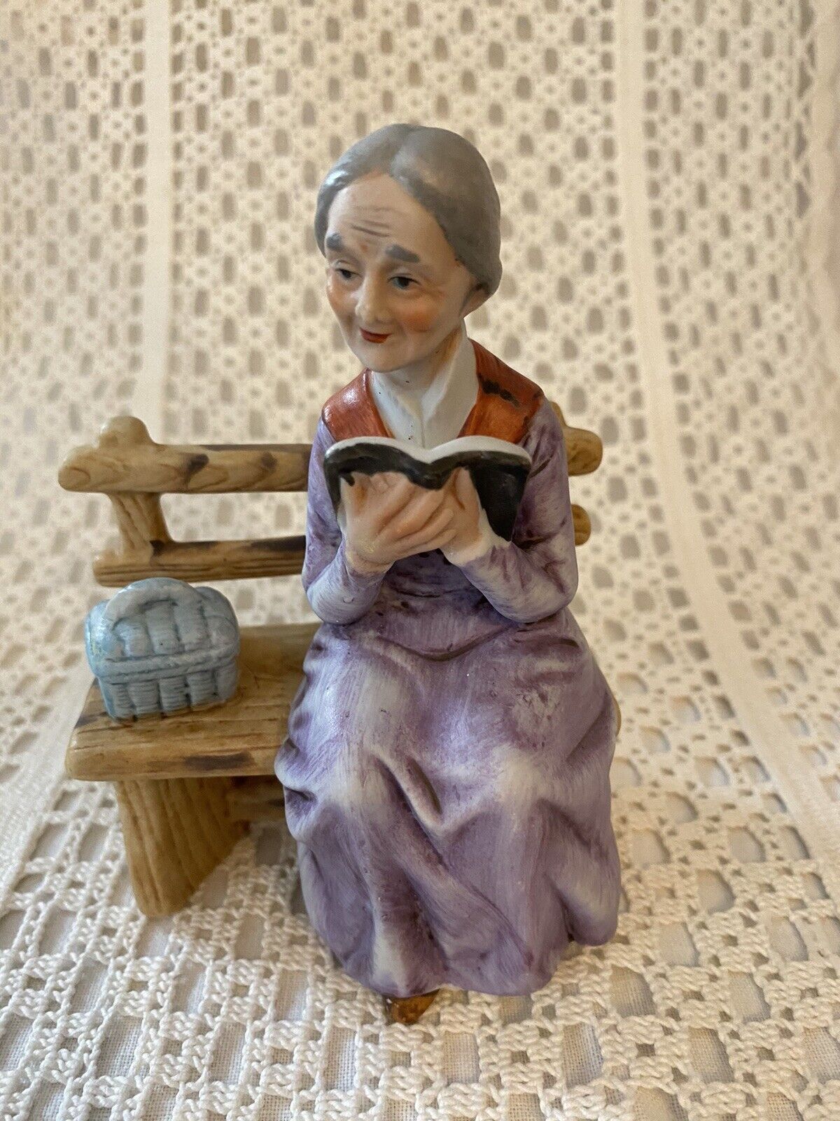 Figurine Old Woman Reading on a Bench~ Basket~ 5”x 4”