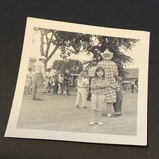 VTG Black & White Snapshot Photo Little Girl Western Wear in Street Cowboys picture
