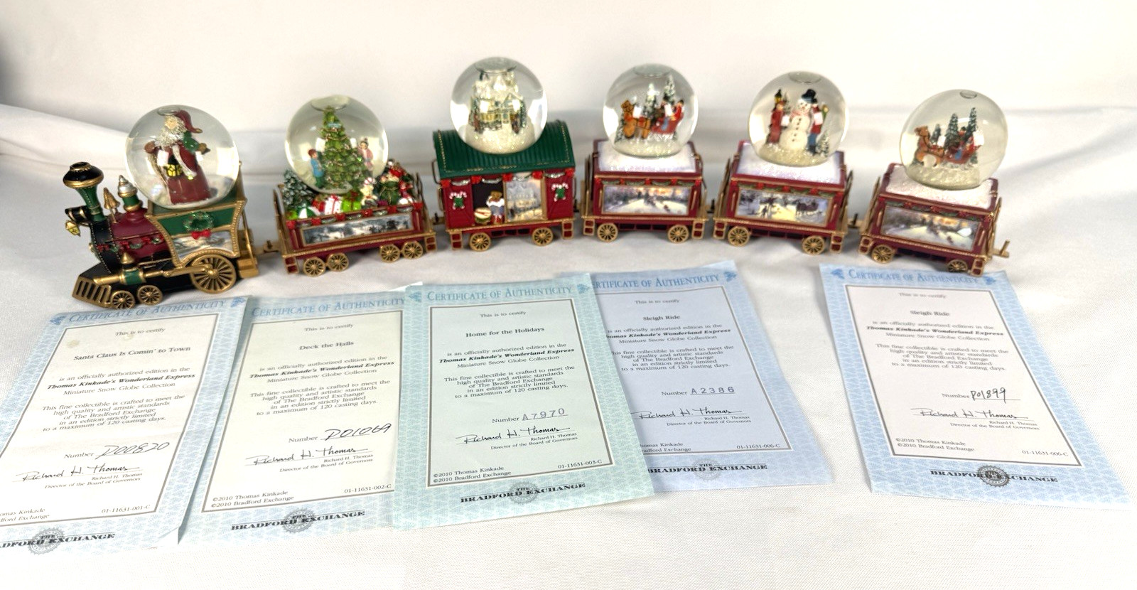 Thomas Kinkade Wonderland Express Snowglobe Train Set 6pc Bradford Exchange COA Thomas Kinkade Wonderland Express Snowglobe Train Set 6pc Bradford Exchange COA