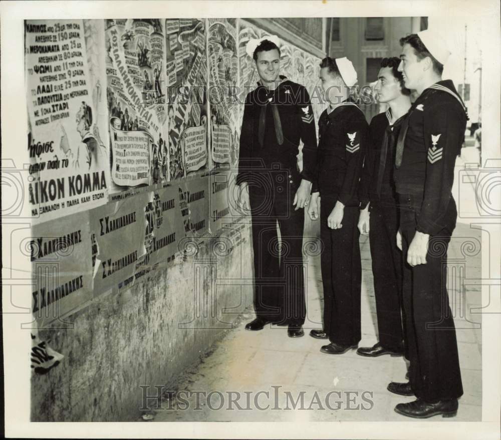 1946 Press Photo U.S. sailors look over political posters in Athens, Greece