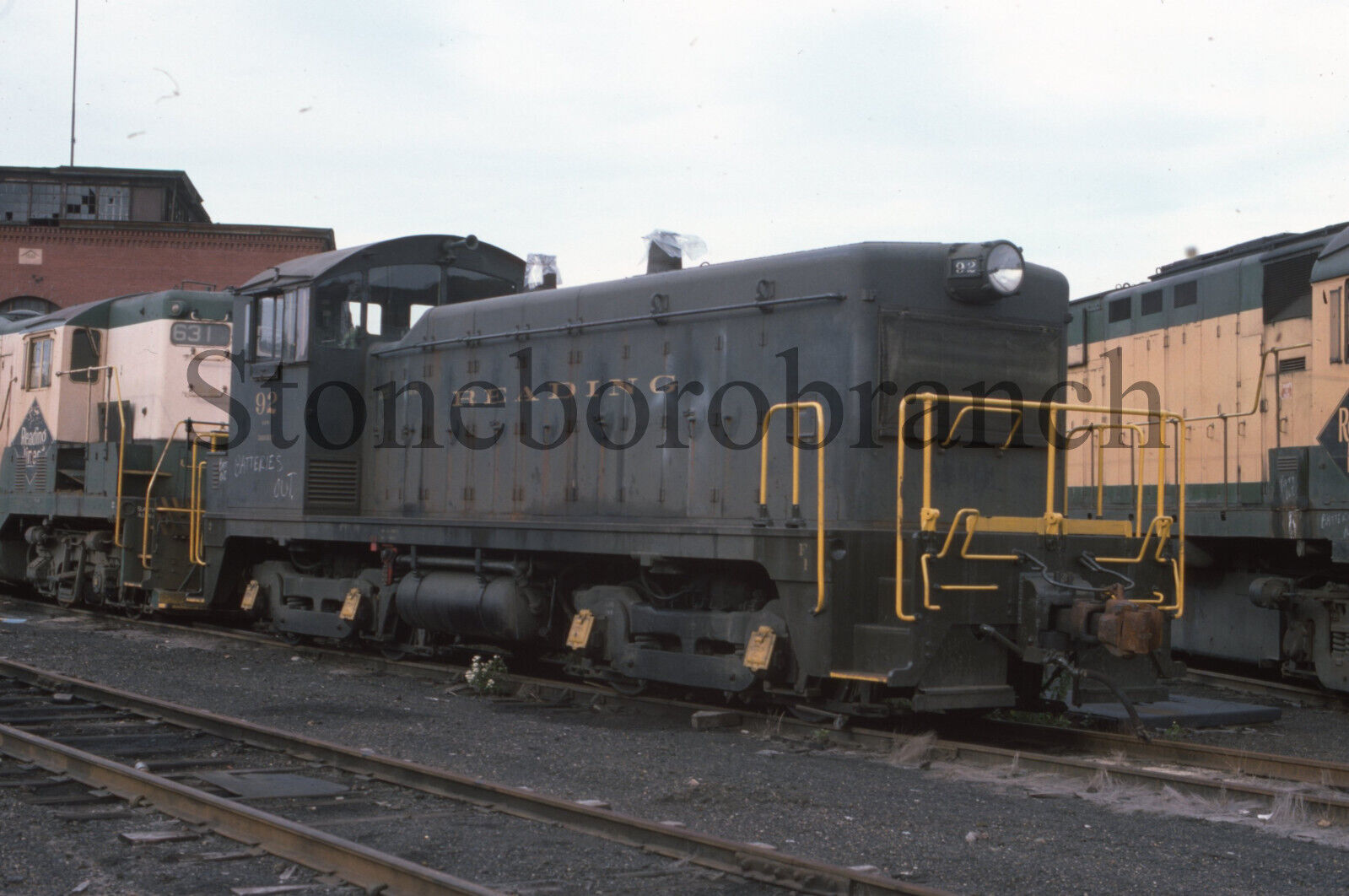 K.) Original RR slide: Reading NW2 #92 in OLD livery @ Reading PA; 10/16/1975