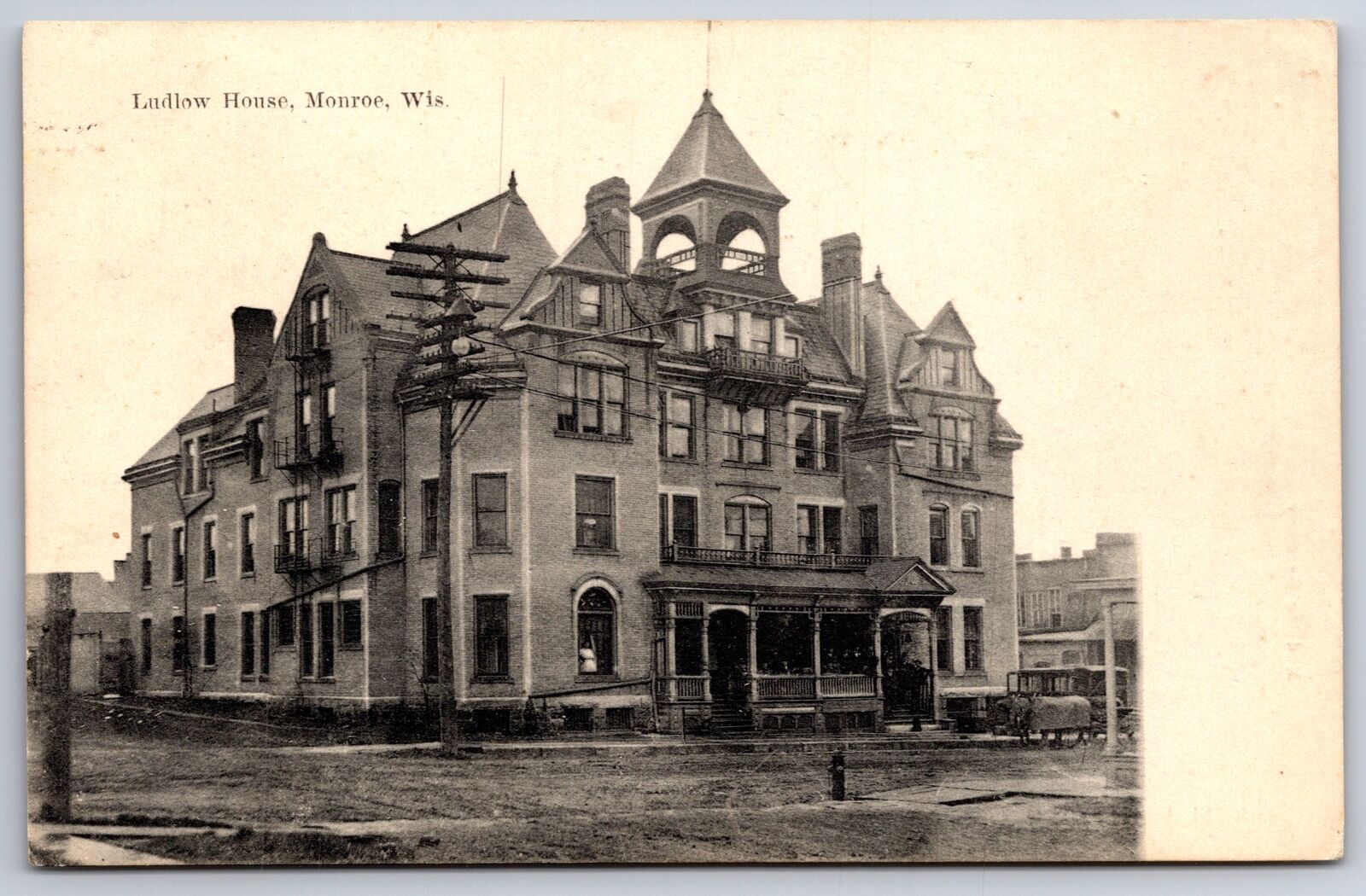 Monroe Wisconsin~Ludlow House~Men On Porch~Lady Looks Out Window~1908 Postcard