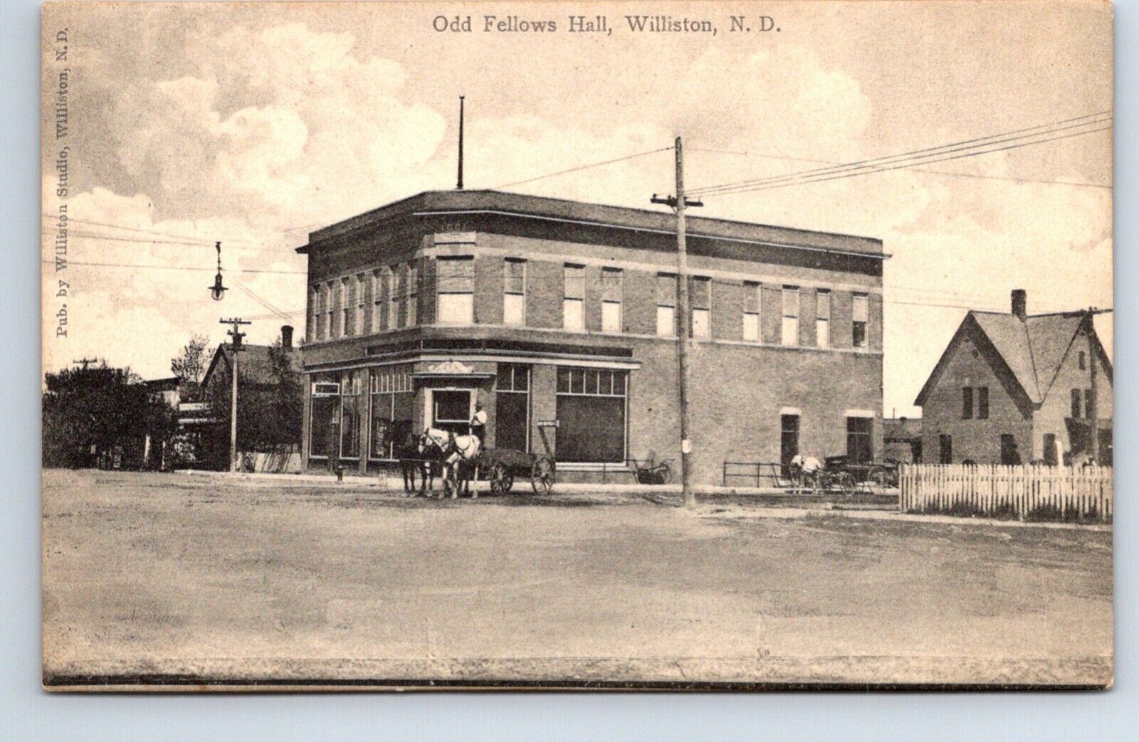 Postcard North Dakota Williston Odd Fellows Hall Charles E Morris Publisher Stre