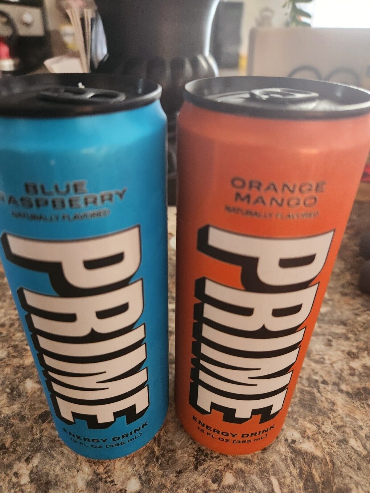 2 Prime Energy Drinks Blue Raspberry and Orange Mamgo